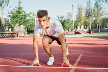 man doing exercises outdoors on the playground