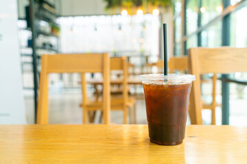 iced black coffee cup on table