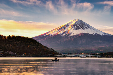 Fuji Mountain and Fisherman boat in Kawaguchiko lake at Sunrise, Yamanashi, japan