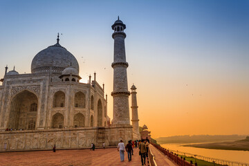 The Taj Mahal is an ivory-white marble mausoleum on the bank of the Yamuna river in the city of...