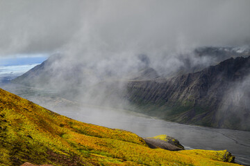 Looking west from the Skaftafellsheidi plateau towards  a fog-covered Morsardalur valley, its jagged mountains and the Skeidararjökull glacier. Skaftafell, Vatnajökull National Park, South Iceland