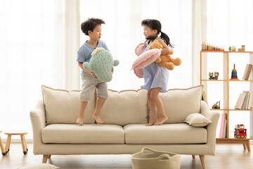 Cute Chinese children playing in living room