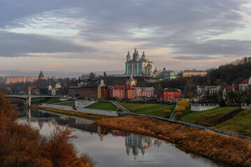 View of the Dnieper River embankment in Smolensk, the Assumption Cathedral and the Smolensk Fortress Wall on a sunny autumn evening, Smolensk, Russia