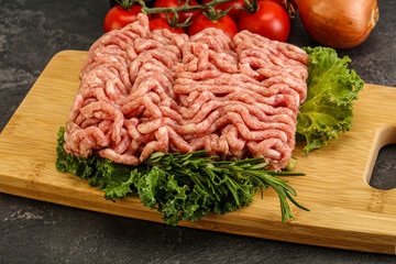 Raw pork minced meat over board