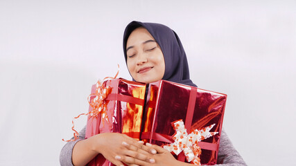 cute asian girl very happy with the gift isolated on white background