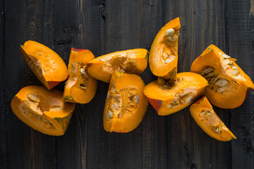 Pumpkin squash. pumpkin slice on green background, closeup. Organic agricultural product, ingredients for cooking, healthy food vegan