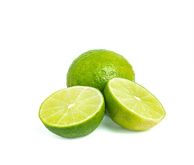 An image closeup isolated whole lime or lemon ripe one slice green color sour taste for cooking or beverage is food or fruit from nature on the white background.