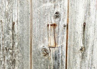 an old hook on a wooden wall