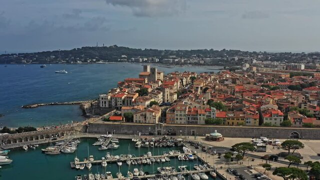 Antibes France Aerial v39 cinematic dolly in shot capturing port vauban, la gravette beach and downtown historical roman townscape - July 2021