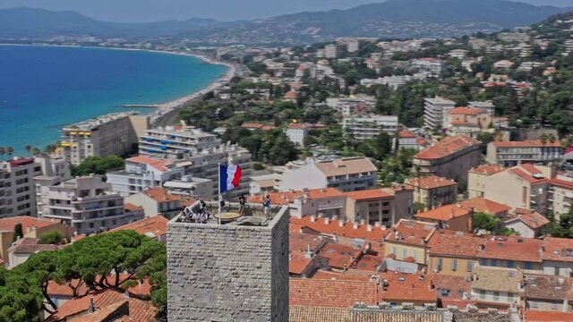Cannes France Aerial v35 low level drone flying around chateau de la castre, medieval watchtower capturing surrounded cityscape and old port - July 2021