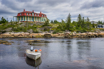 View on Baie Johan Beetz historic house on the shore of the St Lawrence river, in Cote Nord region...