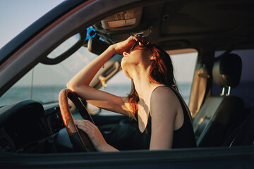 Plakat woman driving in car trip posing fashion travel