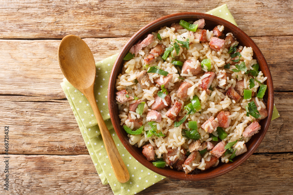 Sticker arroz de carreteiro brazilian rice with dried meat close up in the bowl on the table. horizontal top