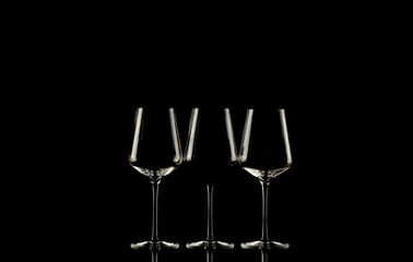 Sharp of wine cups against black background