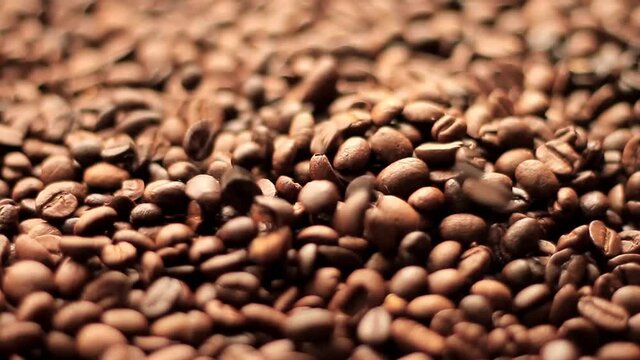 roasted brown coffee beans in a heap stock video