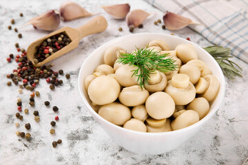 Pickled mushrooms - champignons in a bowl. Delicious mushrooms, champignon.