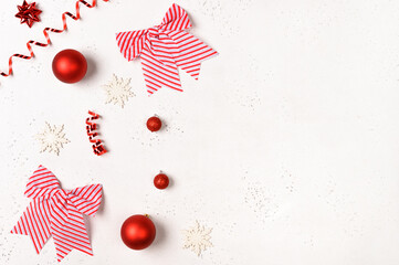Christmas frame with balls, red, golden decorations on white background with empty space to the text. New year concept. Flat lay, top view, copy space
