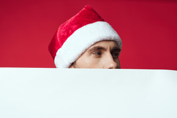 handsome man in New Year's clothes advertising copy space red background