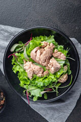 Cod liver salad seafood mix lettuce leaves fish omega-3 fresh meal snack on the table copy space food background keto or paleo diet vegetarian food no meat pescetarian diet