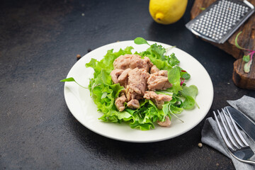 Cod liver salad seafood mix lettuce leaves fish omega-3 fresh meal snack on the table copy space food background keto or paleo diet vegetarian food no meat pescetarian diet