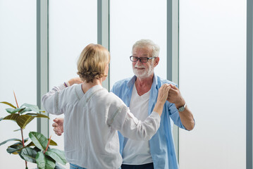 Elderly couple dancing together with happy and romantic emotion.
