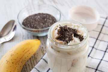 A healthy and healthy breakfast of homemade yoghurt with banana and chia seeds.