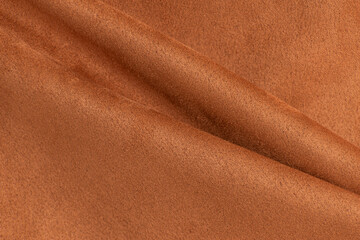 Draped suede. Brown suede fabric. Sewing suede