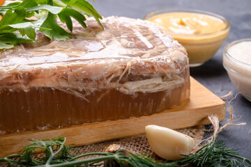 Jellied meat made from frozen broth, served with mustard and horseradish.