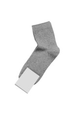 Pair of new socks with unbranded mockup label tag isolated on white background.