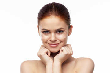 Fototapeta premium cheerful woman bare shoulders clear skin face mask