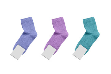 Three pairs of new colorful socks with unbranded mockup label tag isolated on white background.
