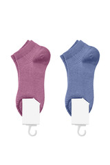 Set of pink and blue socks with unbranded mockup label tag isolated on white background.