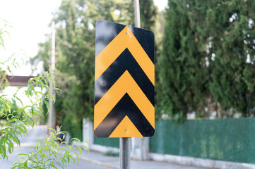 traffic safety signs on city street road. direction movement sign outdoor. danger warning symbol on...