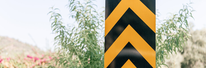 traffic safety signs on city street road. direction movement sign outdoor. danger warning symbol on...