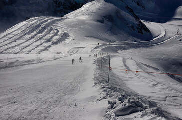 skiers going toward ski slopes after getting out of Metro Alpin, Mittelallalin 3500 m, Saas-Fee,...