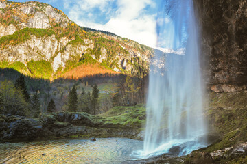 Beautiful autumn scene at Goriuda waterfall in the Julian Alps. Chiusaforte, Udine province, Friuli...