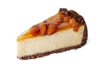Piece of cheesecake with nuts isolated on white background