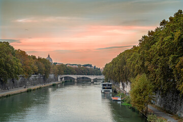 Fototapeta na wymiar Romantic sunset on the Tiber river in Rome