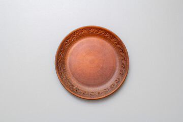 beautiful, empty, brown plate, on a gray background, top view
