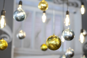 Silver and golden decoration Christmas balls collection hanging with christmas lights