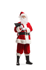 Full length portrait of Santa Claus holding a clipboard and looking at camera