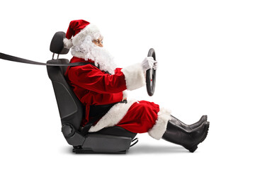 Fototapeta Santa Claus holding a steering wheel and wearing a seatbelt obraz