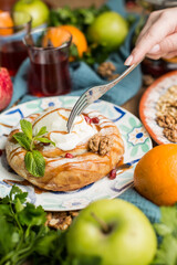 round cake in oriental style with a scoop of ice cream.
