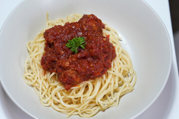 pork spaghetti on a white ceramic bowl background, food, nature, italian food