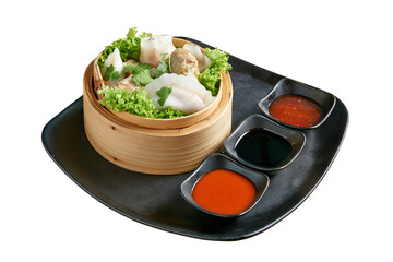 Overhead view on Dim Sum in Bamboo Basket isolated on white