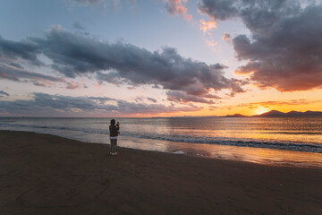 sea, beach, building, city, clouds, sky, water, people, sunset, photographers