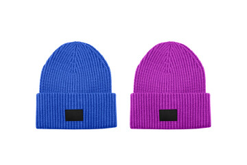 Blue and pink knitted beanie hats with black unbranded mockup label isolated on white background.