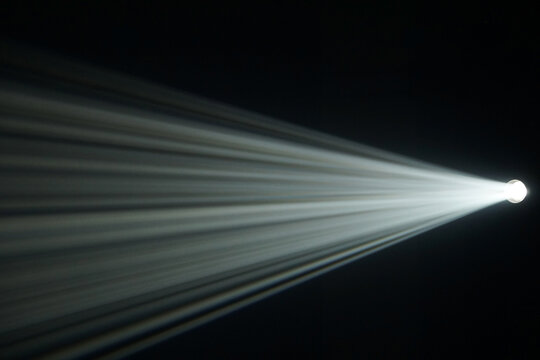 Light beam from spotlight or projector texture and black  background  and copy space - backdrop image