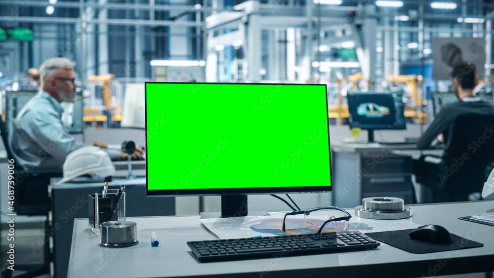Leinwandbilder Car Factory: On the Desk Green Screen Chroma Key Computer. In Background Diverse Team of Engineers Work in Office of Automated Robot Arm Assembly Line Manufacturing Vehicles