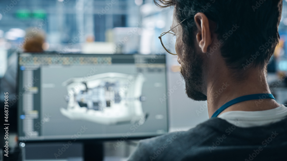 Leinwandbilder Car Factory Office: Engineer Working on Turbine Prototype on Computer, Design Advanced 3D Model for High-Tech Green Energy Electric Engine. Diverse Team Work in Automated Manufacturing Facility